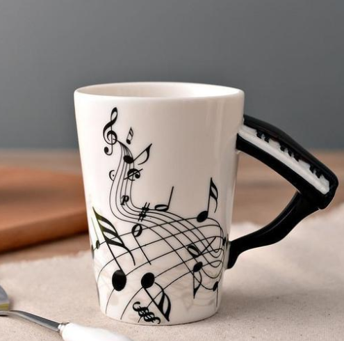 Coffee cup with music notes & saxophone handle