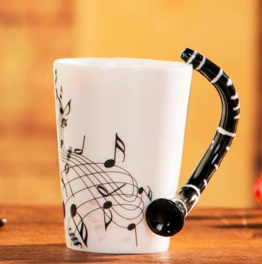 Coffee cup with music notes & saxophone handle